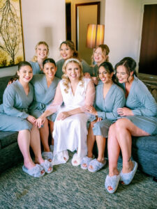 bride with her bride maids wearing their bridal shower outfit ideas