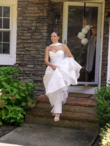 A bride running wearing one of the perfect bridal gowns for outdoor weddings